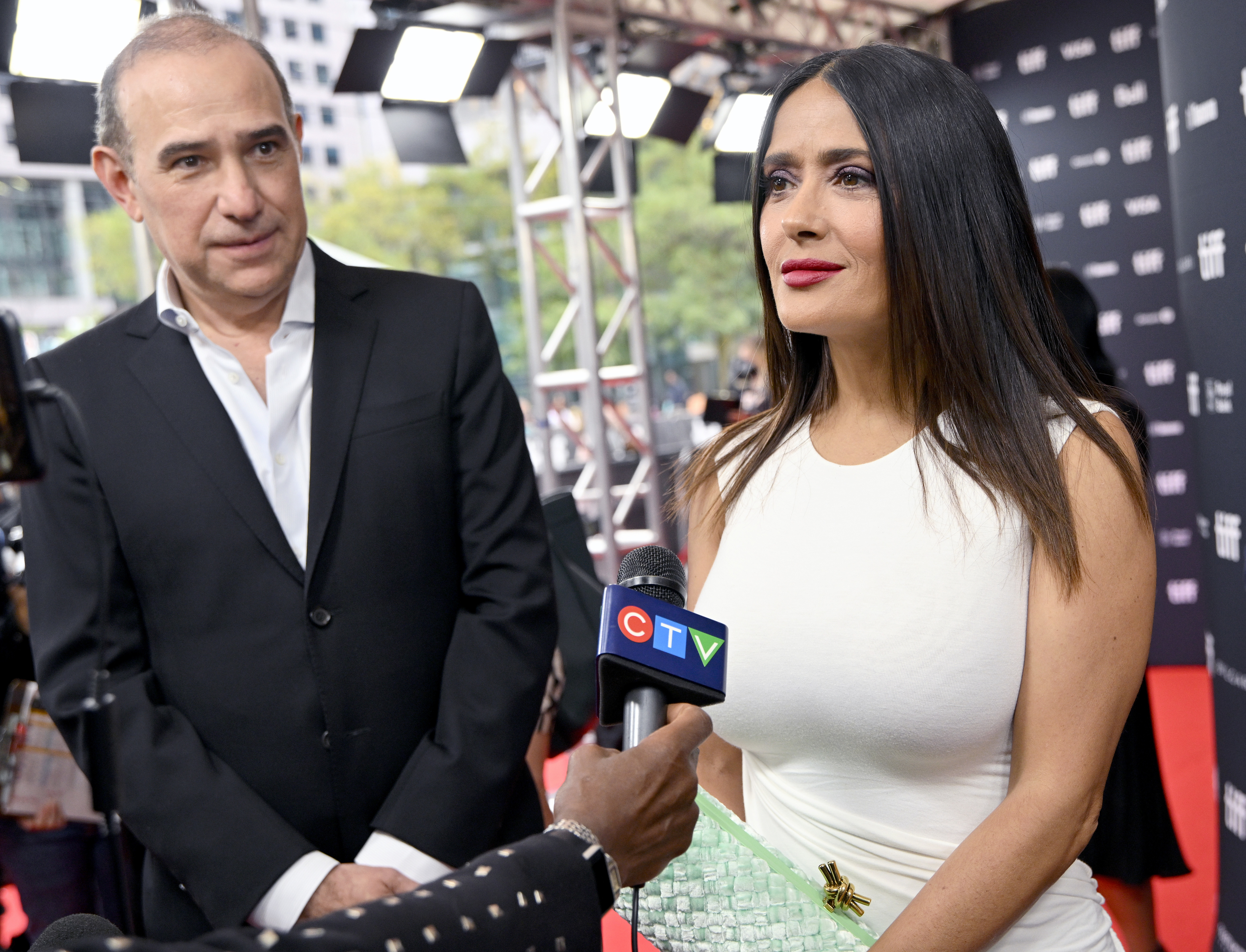 salma doing an interview on the red carpet