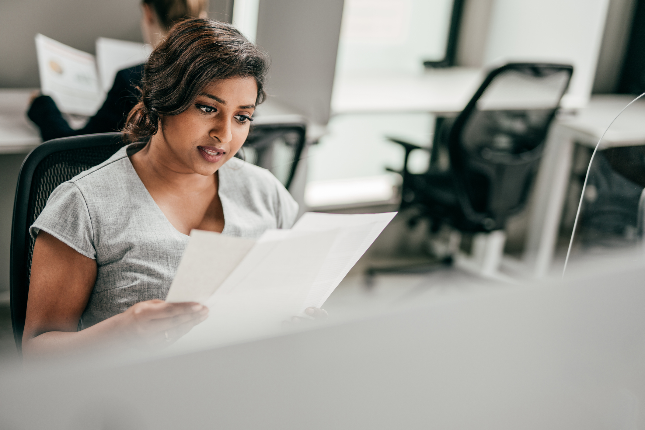 A woman looking at papers