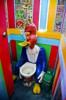 the toilet is a huge cartoon chicken