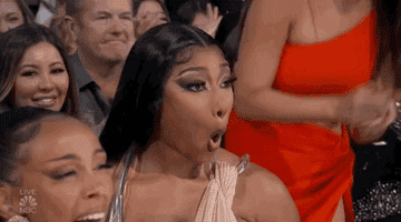 megan thee stallion making a shocked face at the billboard music awards