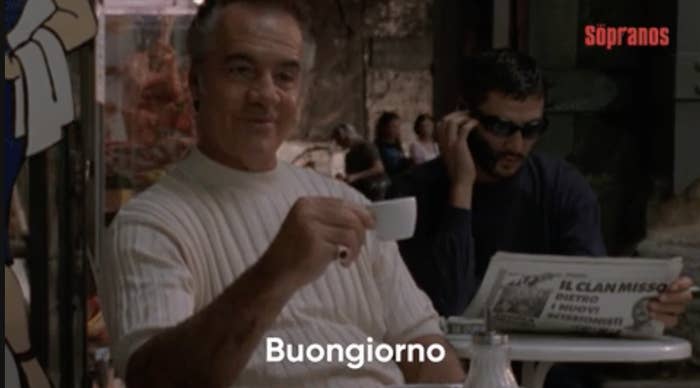 a man holding an espresso cup saying, &quot;Buongiorno&quot;