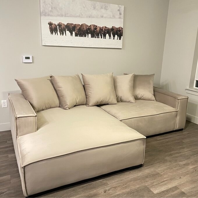 a reviewer photo of the tan couch