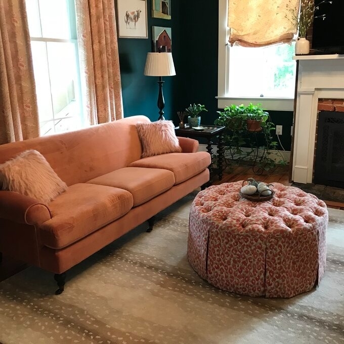 a reviewer photo of the orange-peach couch