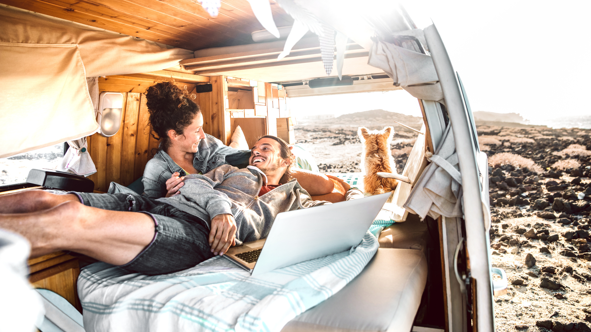 a couple relaxing in their van