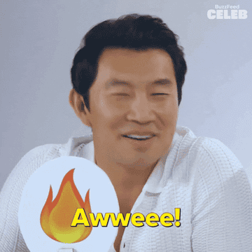 Gif of Simu Liu holding a flame sign and saying &quot;Awwweee!&quot;