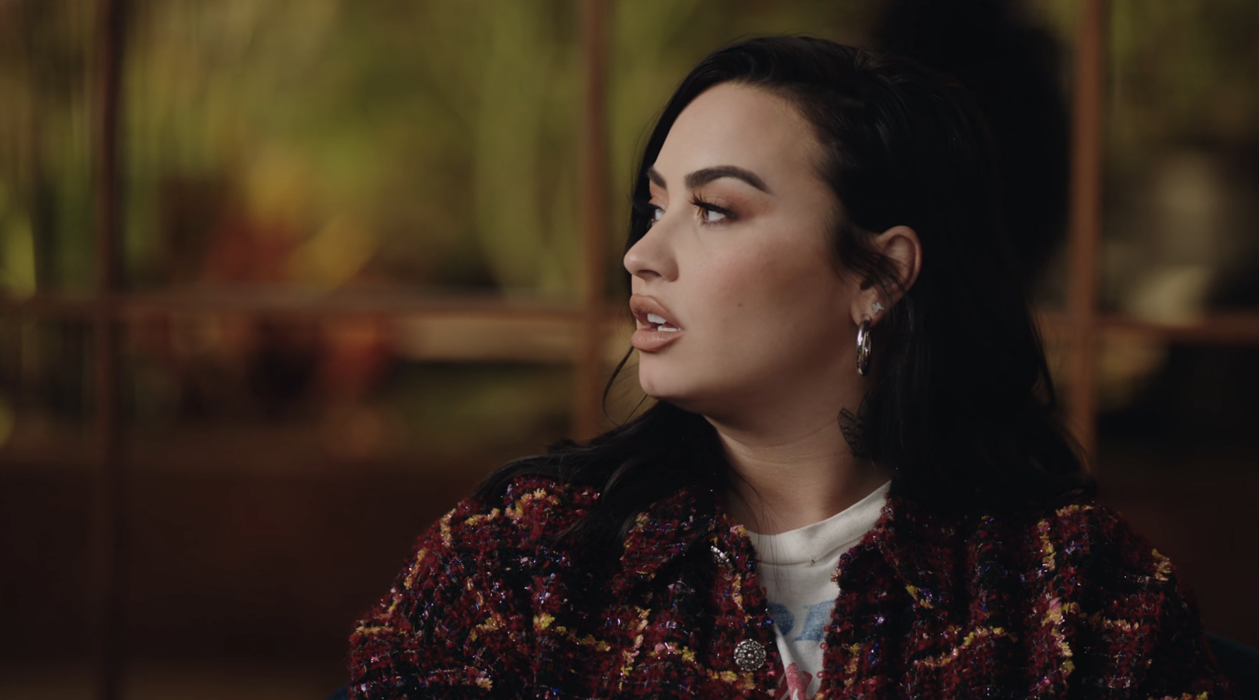 Close-up of Demi speaking