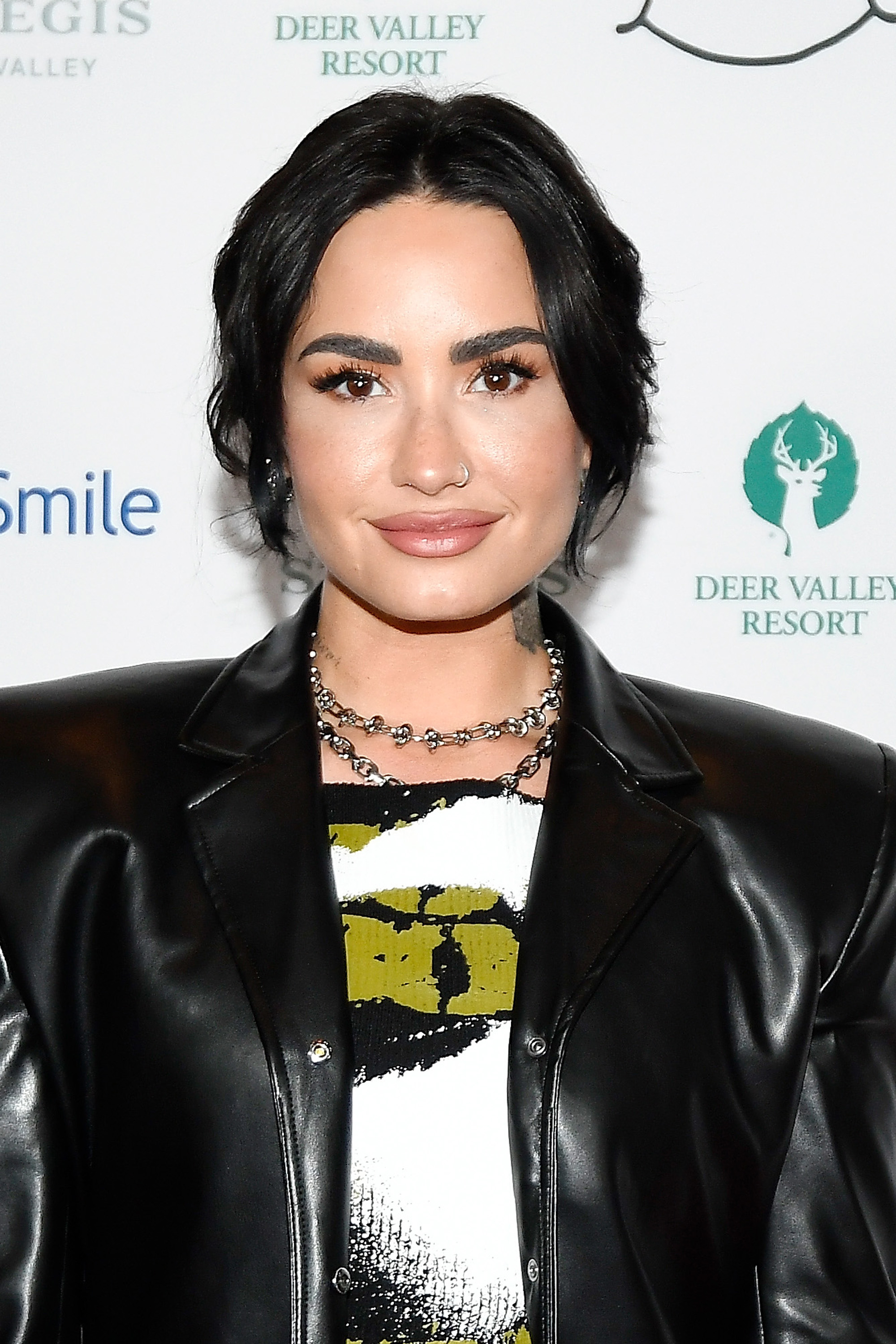 Close-up of Demi at a media event