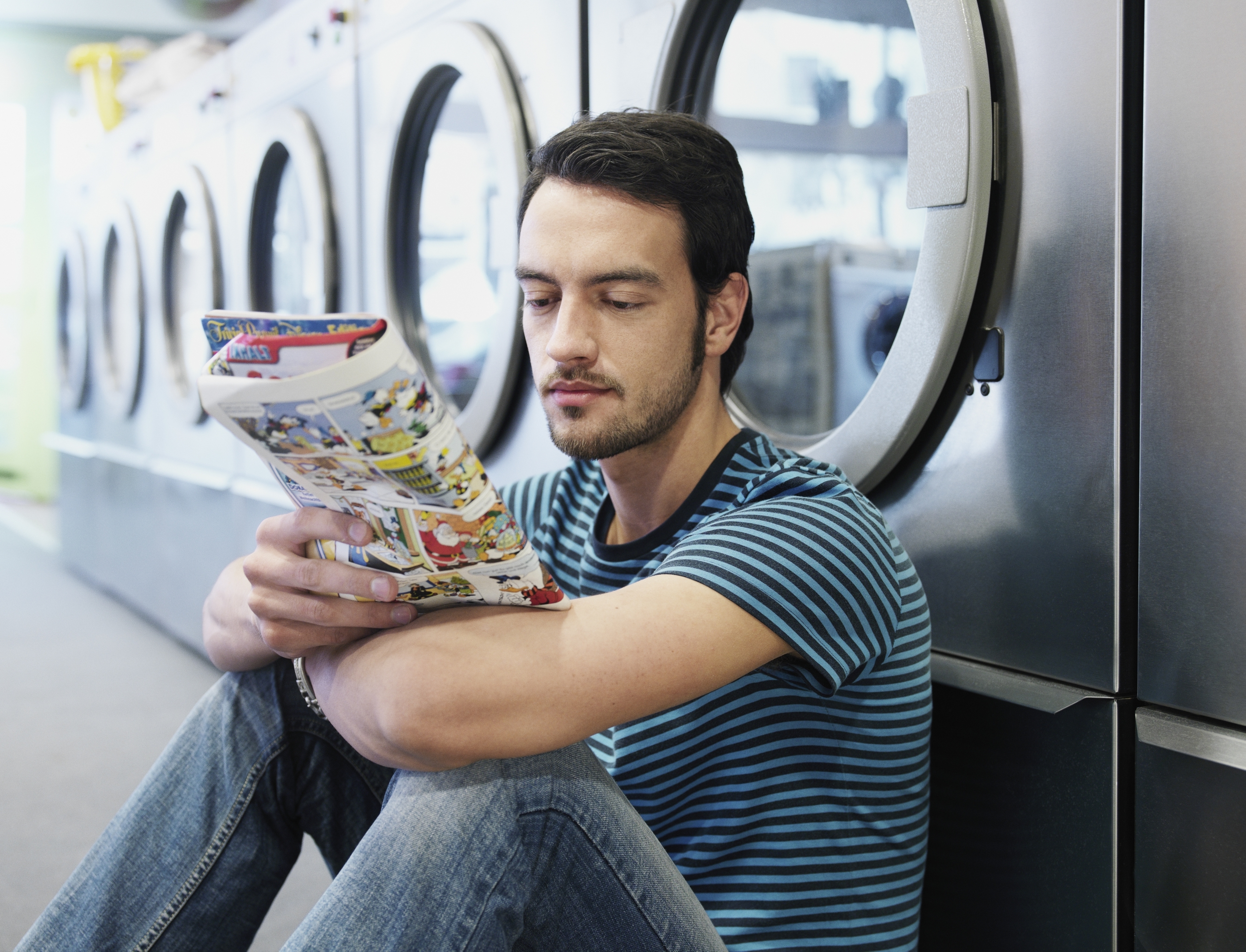 a man reading a comic book