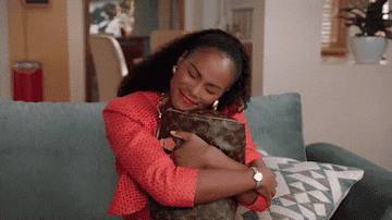 gif of someone hugging their purse