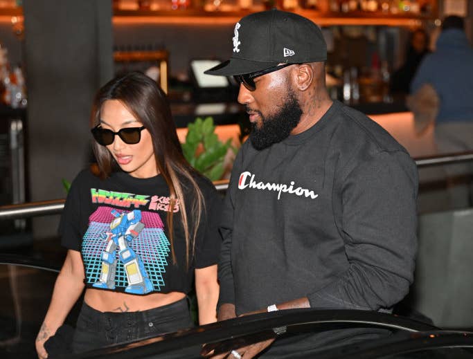 Jeezy and Jeannie Mai walking through a building together