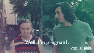 a woman saying &quot;well i'm pregnant&quot; to a man who stops in his tracks
