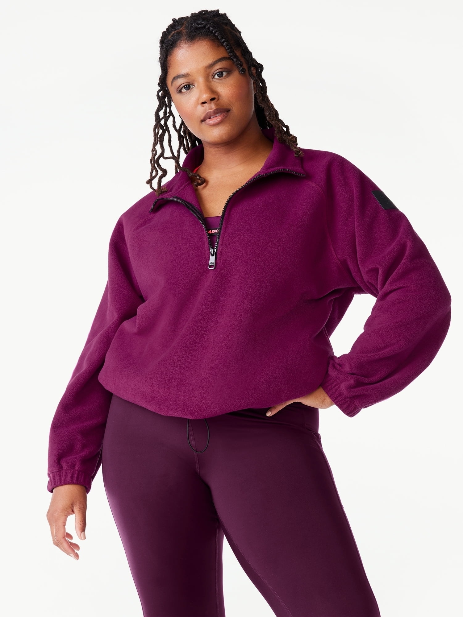 a model wearing the berry colored pullover