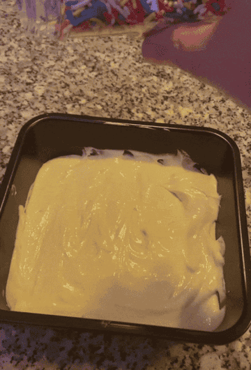 mixture in cake pan with spinkles on top
