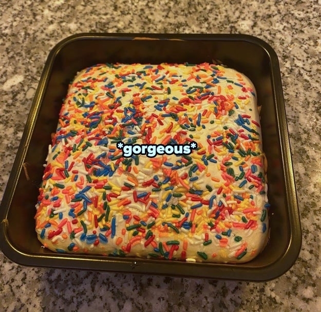 cake sitting on counter with the word &quot;gorgeous&quot; written across it