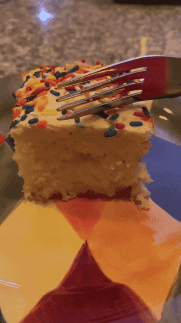 cutting into cake to reveal how moist it is