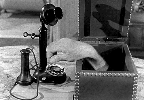 hand in a box dialing a phone