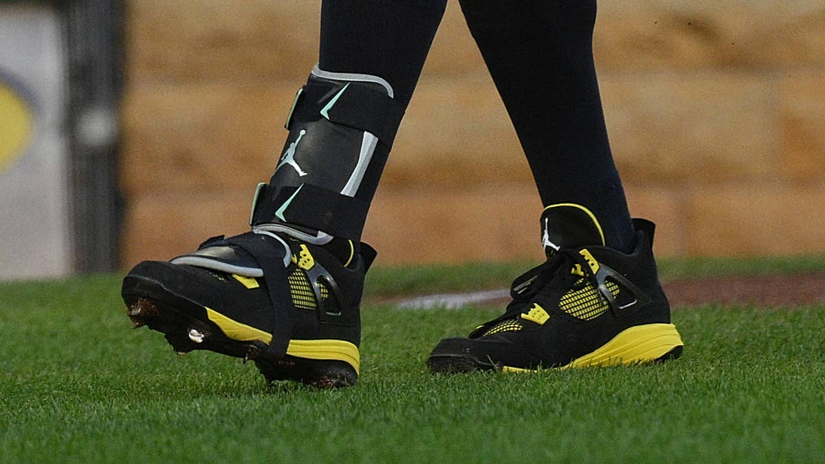 Black and yellow Air Jordan 4 syncs up with Pirates' threads.