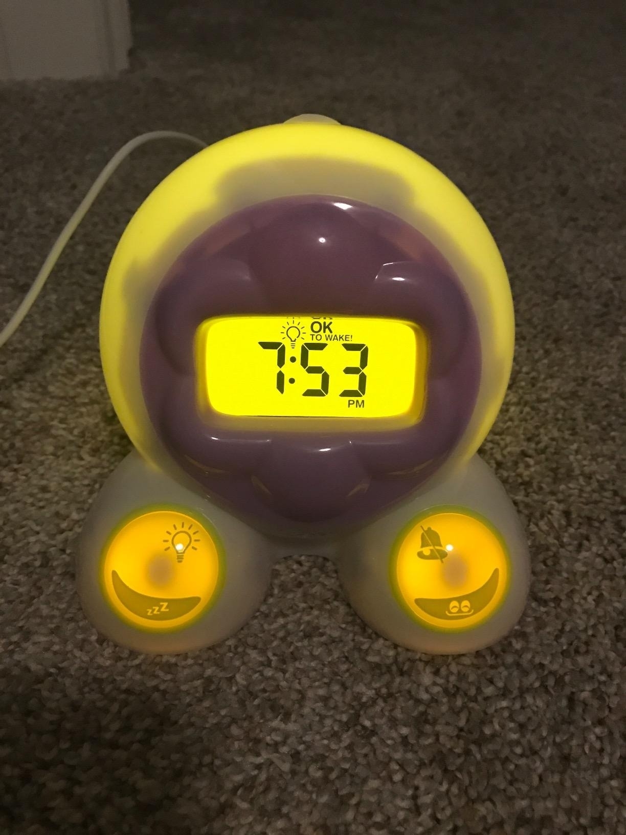 An alarm clock glows