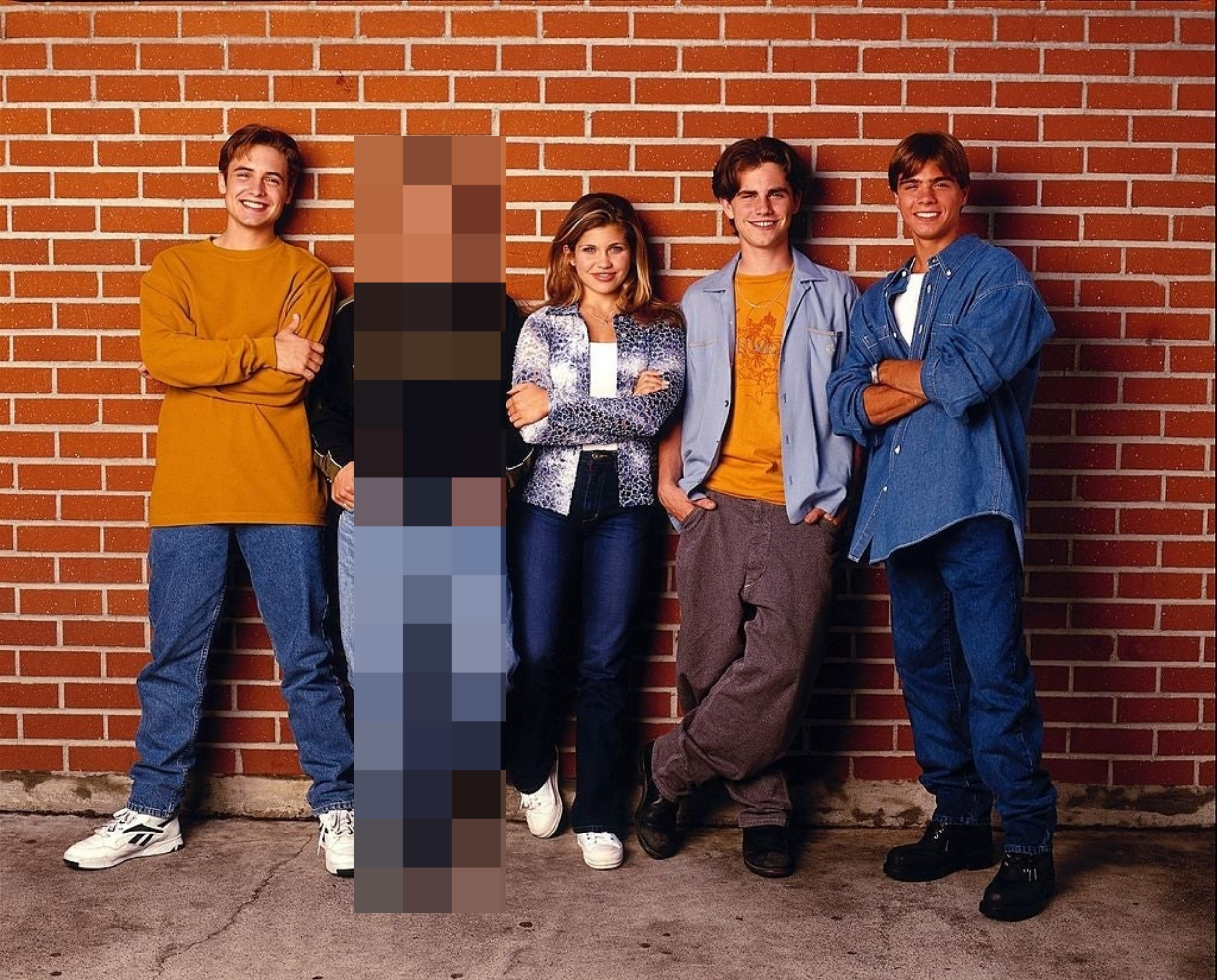 Cast members standing together a wall, with Ben pixelated out