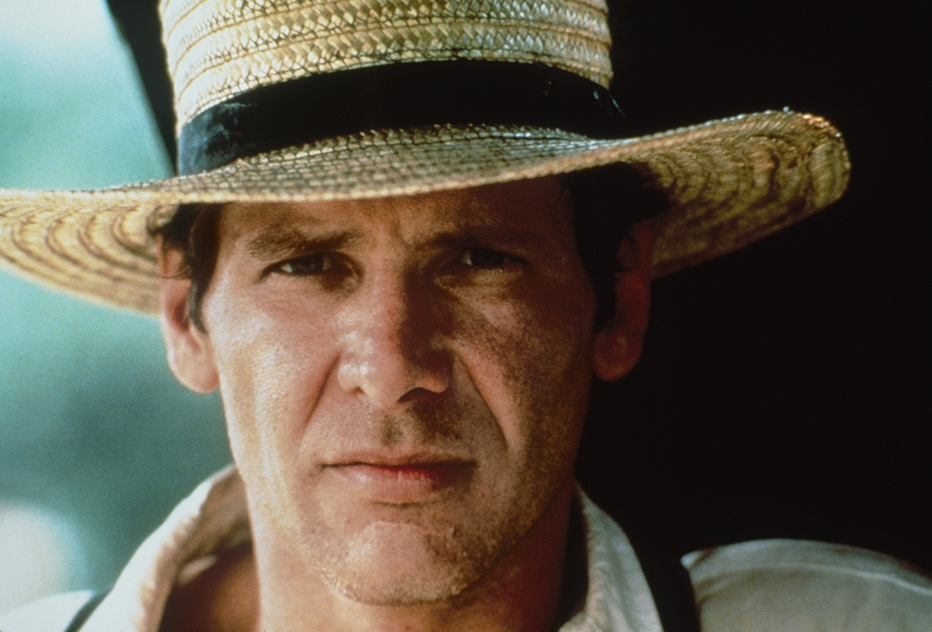 Close-up of Harrison wearing a hat