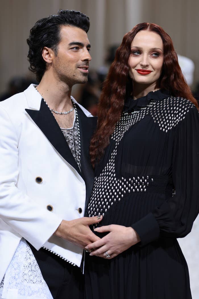 Sophie Turner and Joe Jonas on the red carpet cradling her baby bump