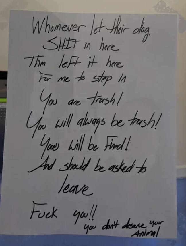 A sign in a lobby says "whoever let their dog shit in here and left it here, you are trash! You will always be trash! You will be fined and should be asked to leave"