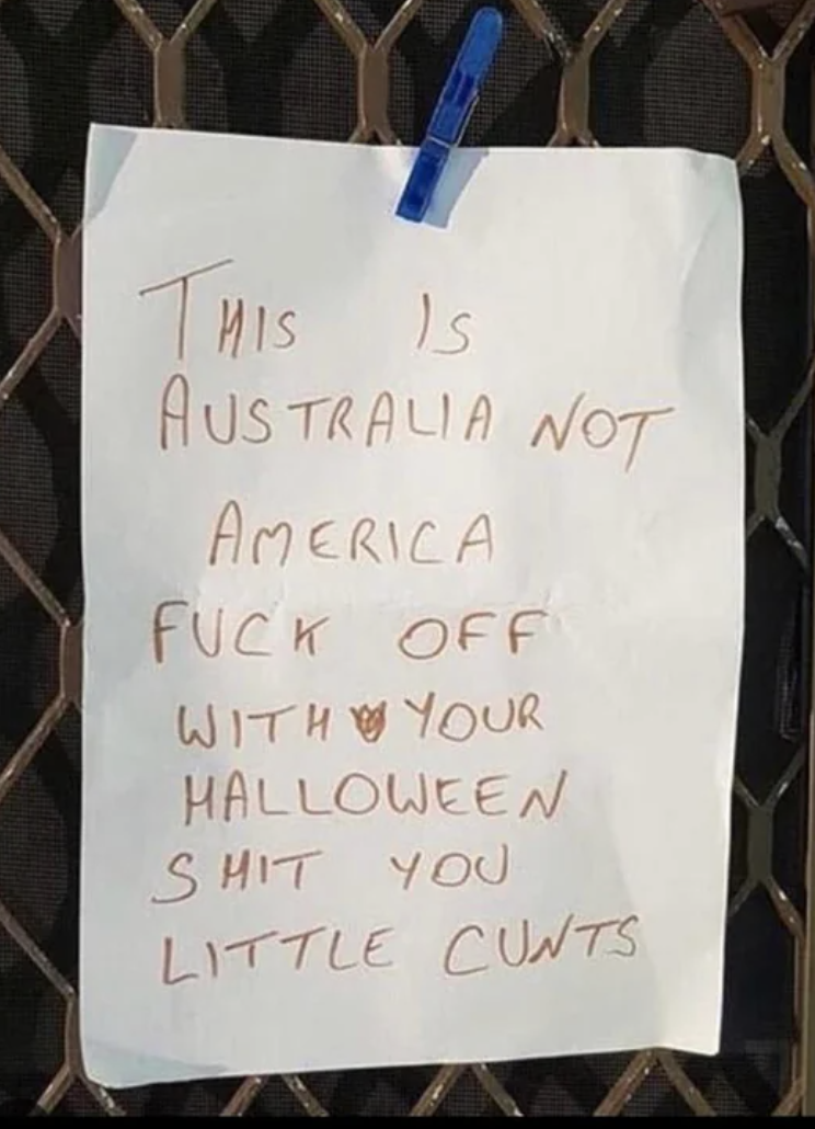 A sign reads &quot;This is Australia not America, fuck off with your Halloween shit you little cunts&quot;