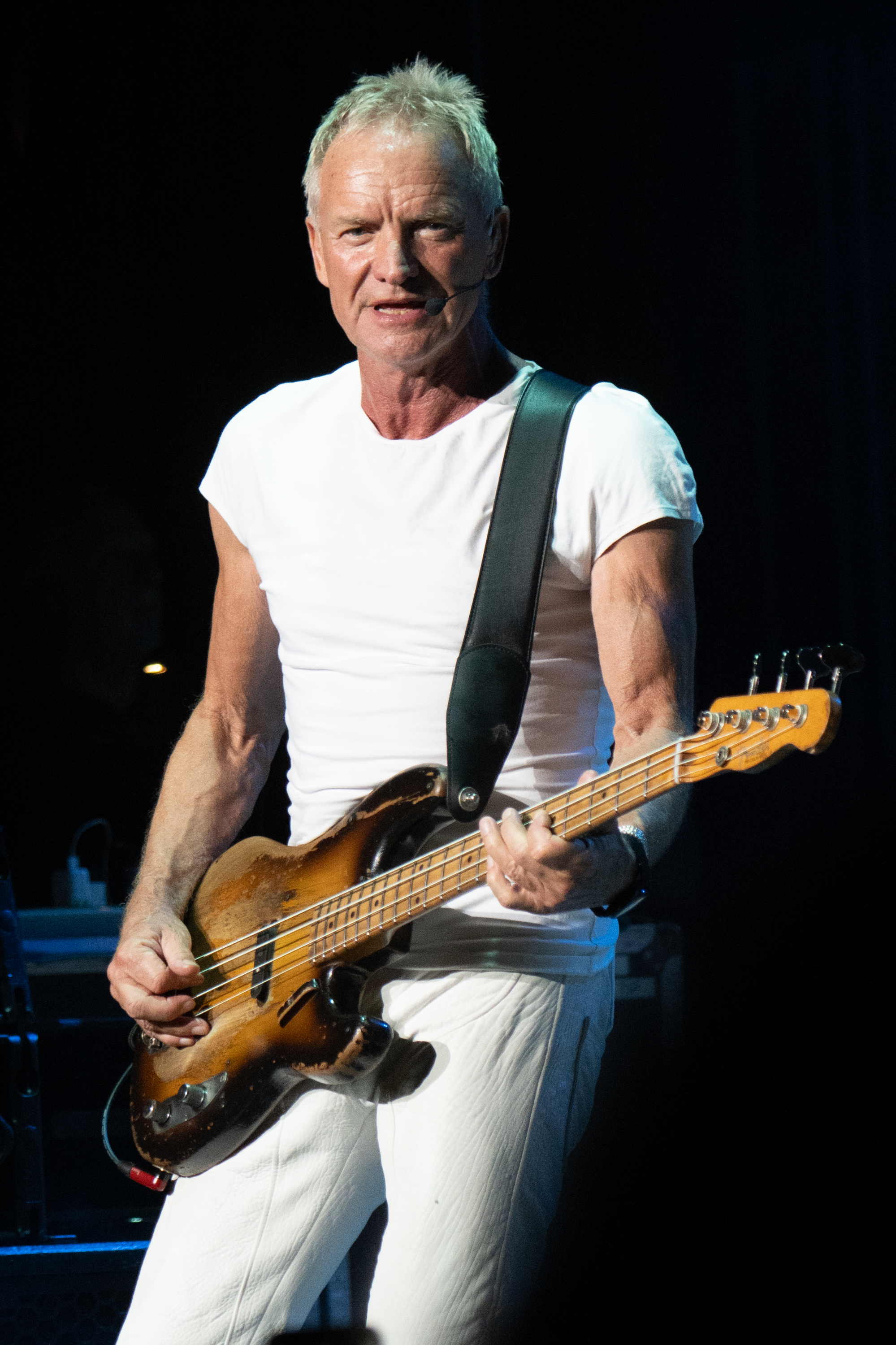 Sting onstage playing the guitar