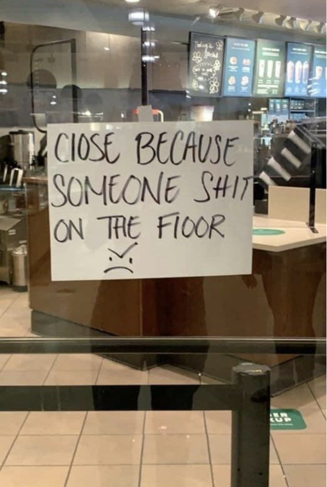 The sign says &quot;closed because someone shit on the floor&quot; with a frowny face