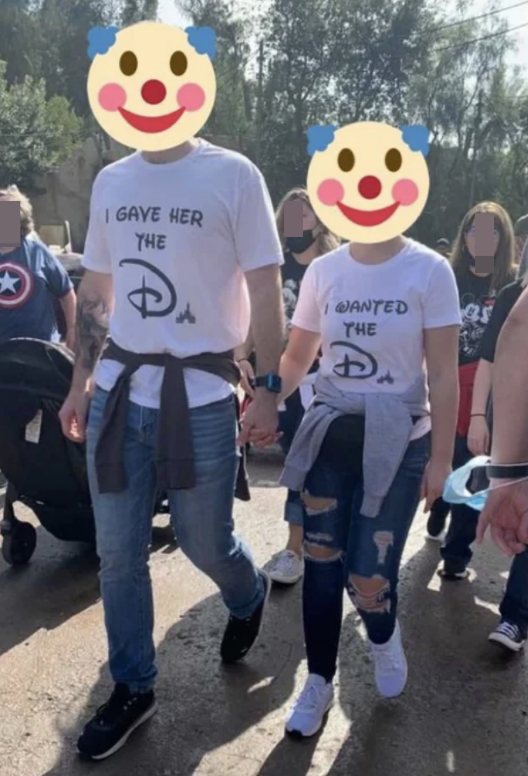 A couple wearing T-shirts, with the man&#x27;s shirt saying &quot;I gave her the D&quot; and the woman&#x27;s shirt saying &quot;I wanted the D,&quot; with both D&#x27;s written in the Disney style
