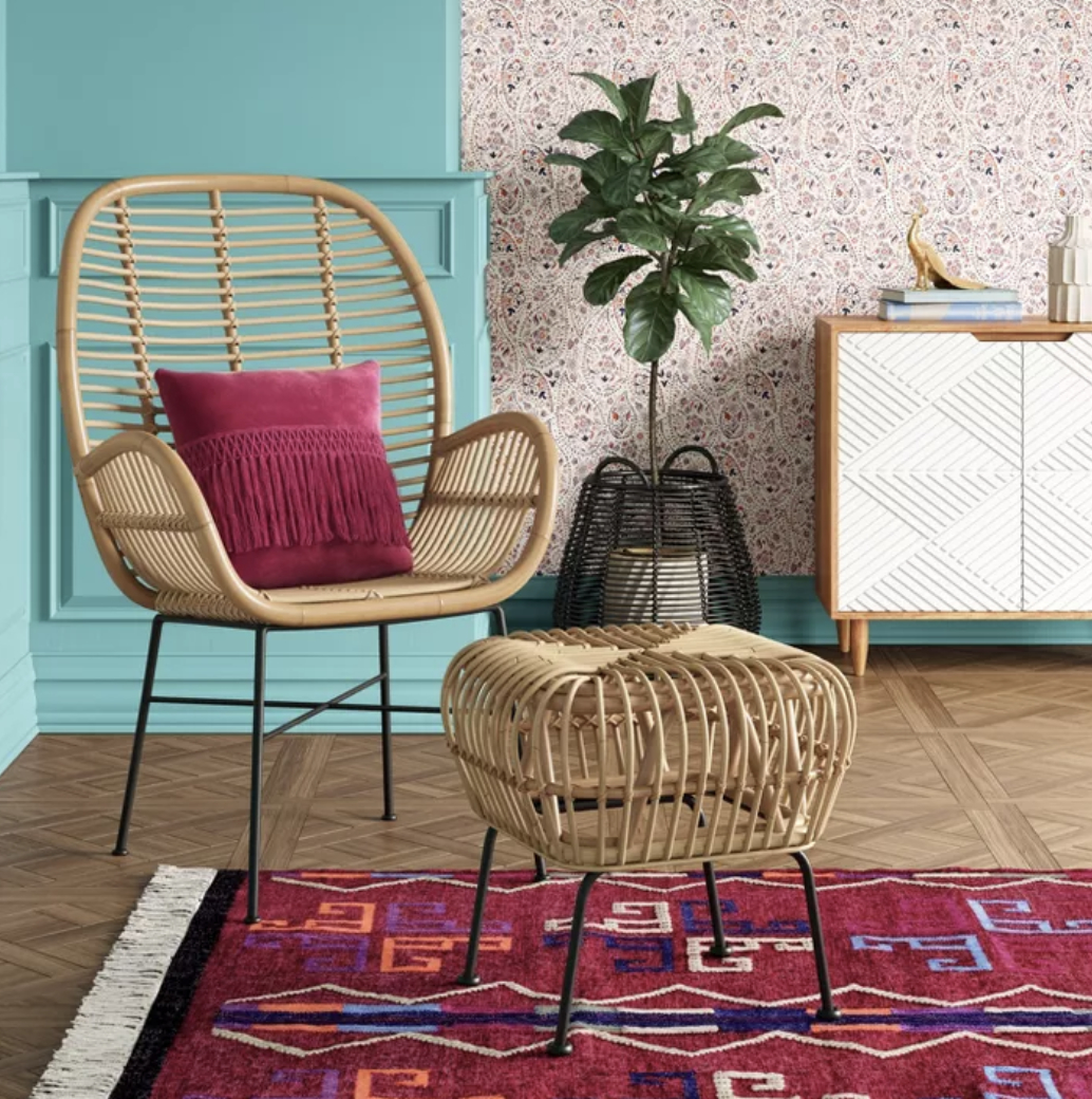The rattan armchair with metal legs