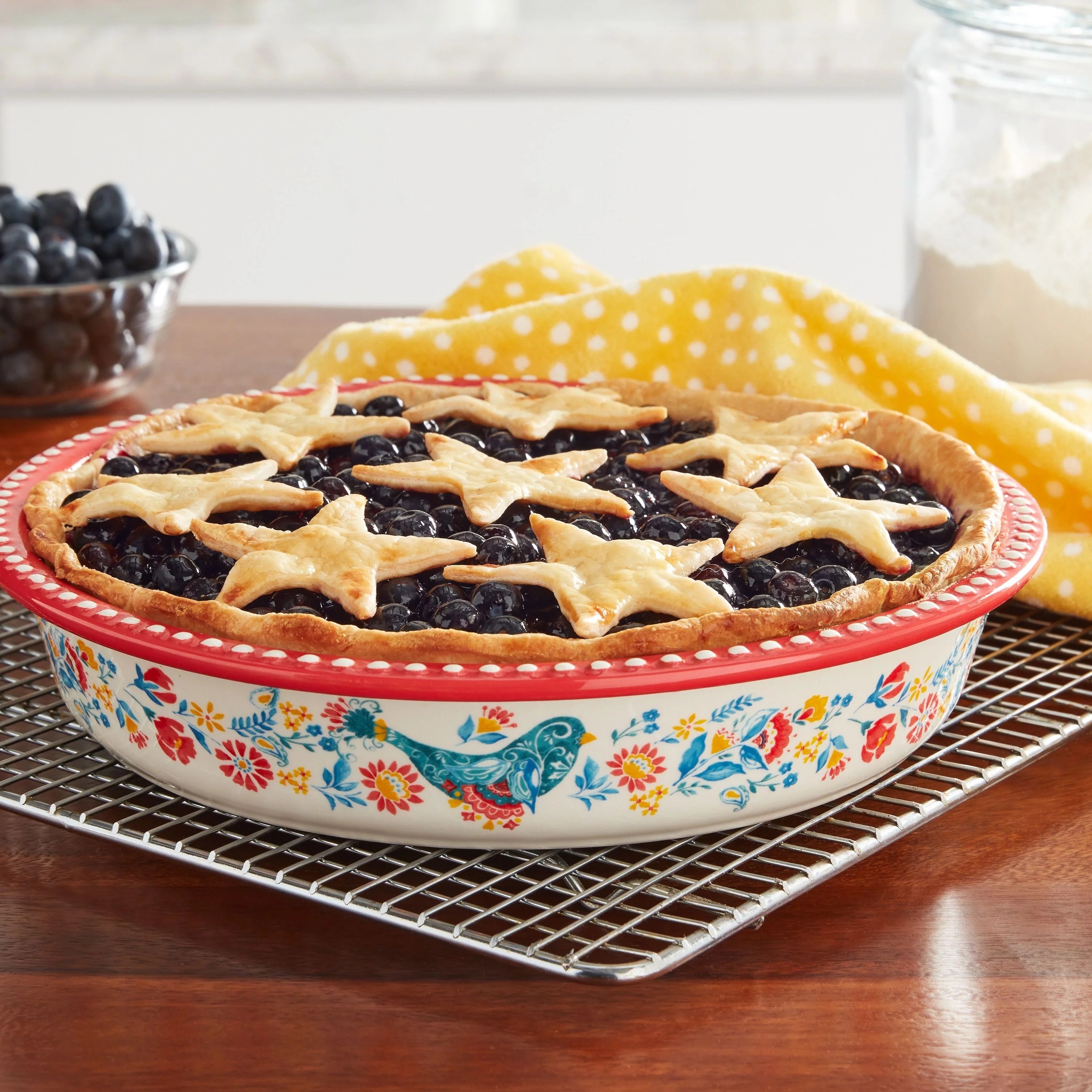 The red and white pie dish, featuring a floral and blue bird design