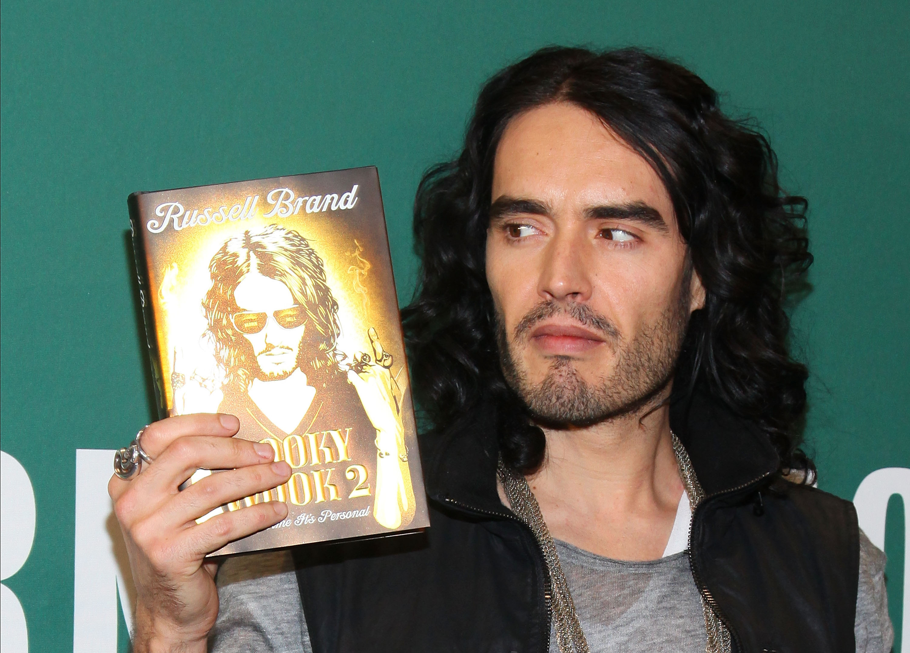 Russell holding up his book