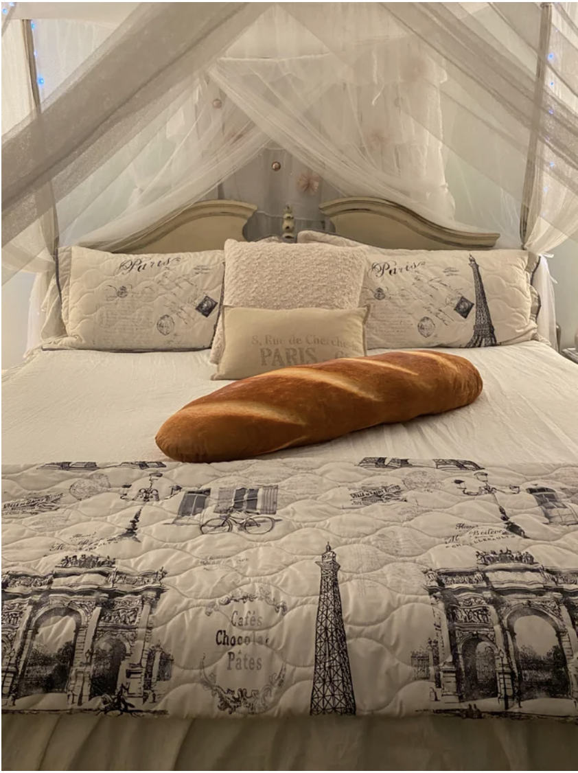 A baguette on a bed