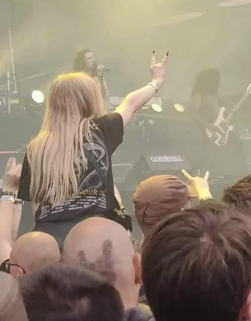 A woman on someone's shoulders