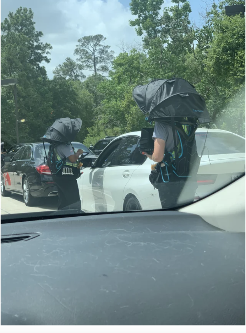 People going up to cars to take their orders