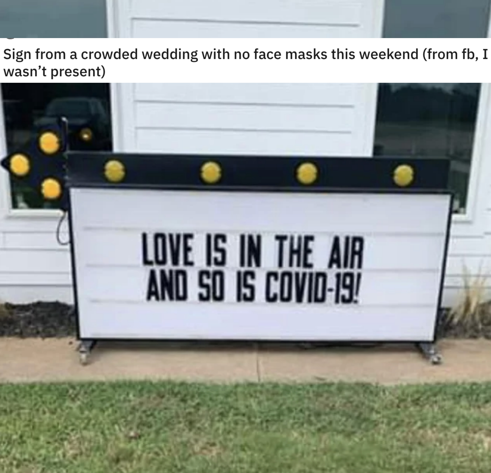 The sign outside the venue says &quot;love is in the air and so is COVID-19&quot;