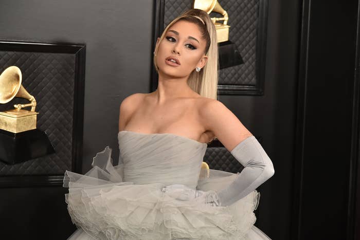 Closeup of Ariana Grande in a strapless chiffon gown and gloves on the Grammys red carpet