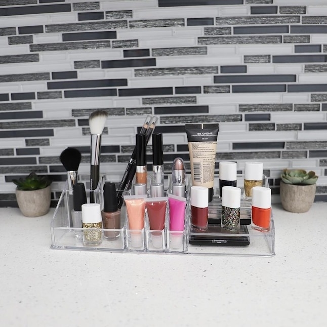 the makeup organizer with cosmetics in it