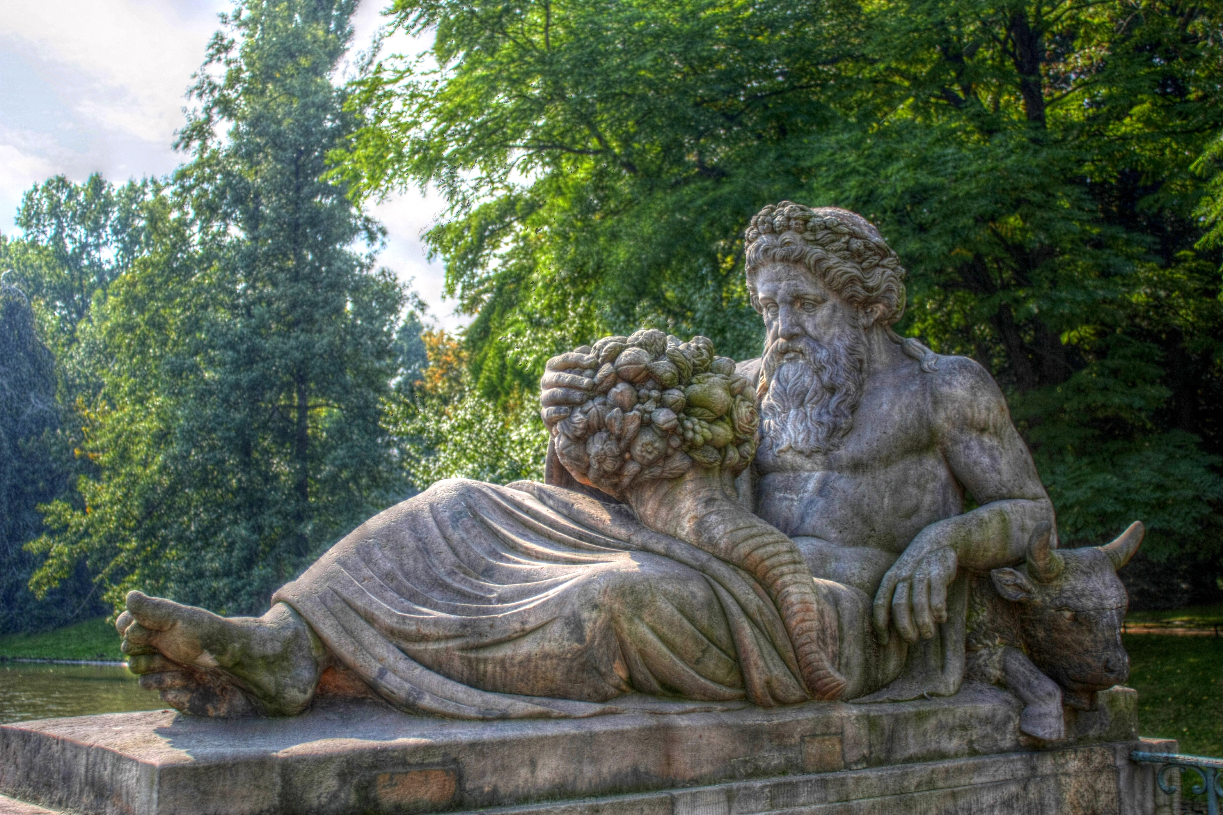 statue of a roman lying down with food in his lap