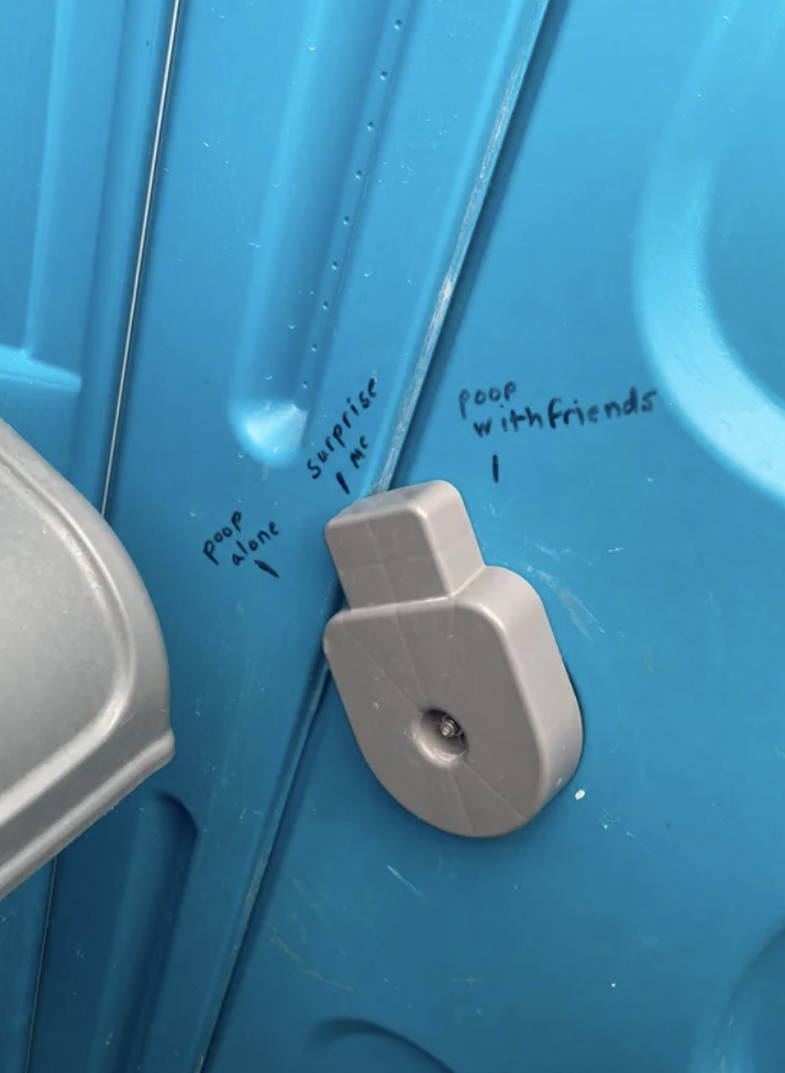 Writing on the inside of a Port-a-Potty