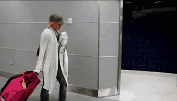 lauren conrad walking with rolling suitcase