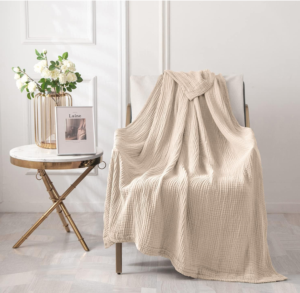 a tan throw blanket draped over a chair