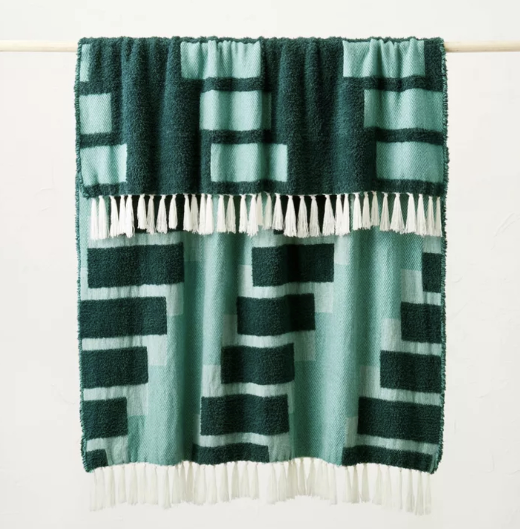 The teal geometric patterned chunky woven throw blanket
