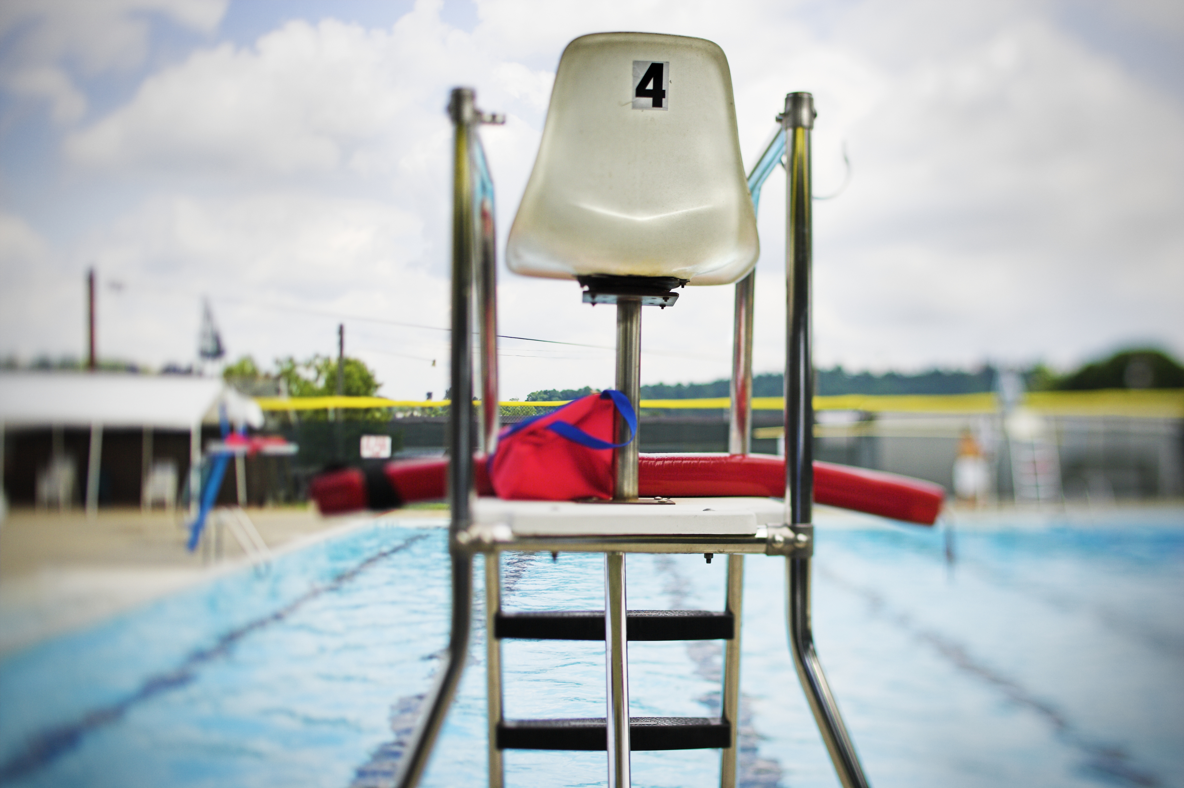 A lifeguard&#x27;s chair at a pool