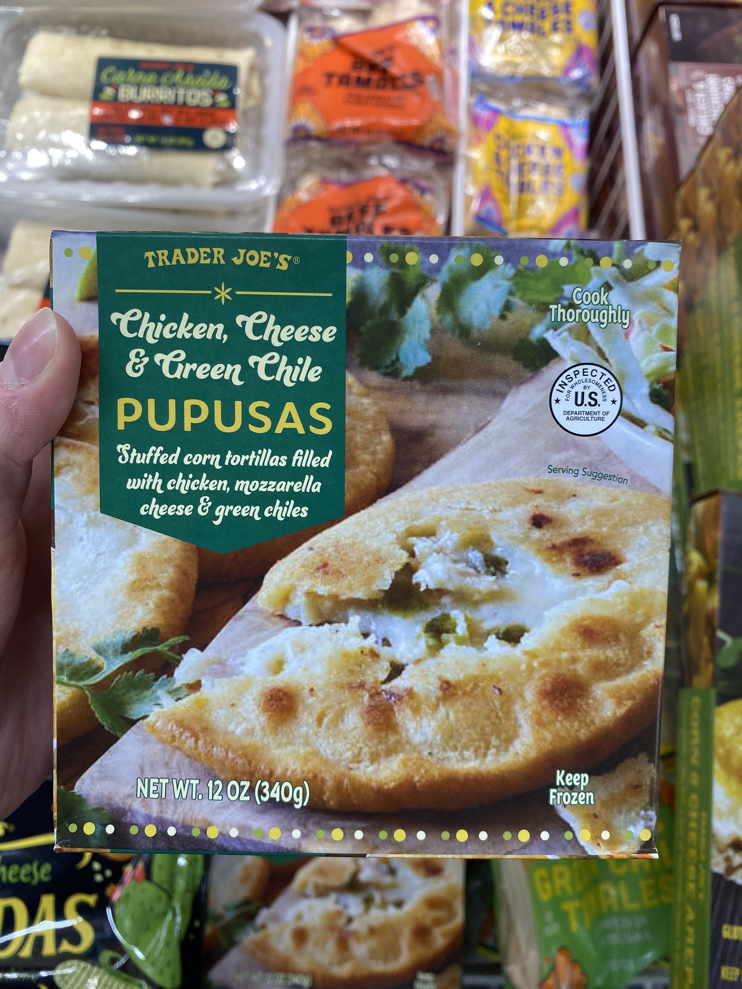 a box of chicken, cheese, and green chile pupusas