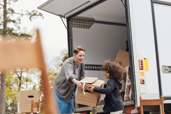 People unloading from a moving truck