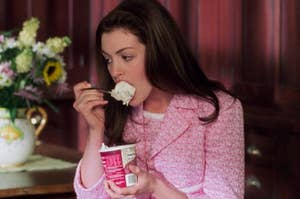 Anne Hathaway eating vanilla ice cream from the pint as Mia in The Princess Diaries 2