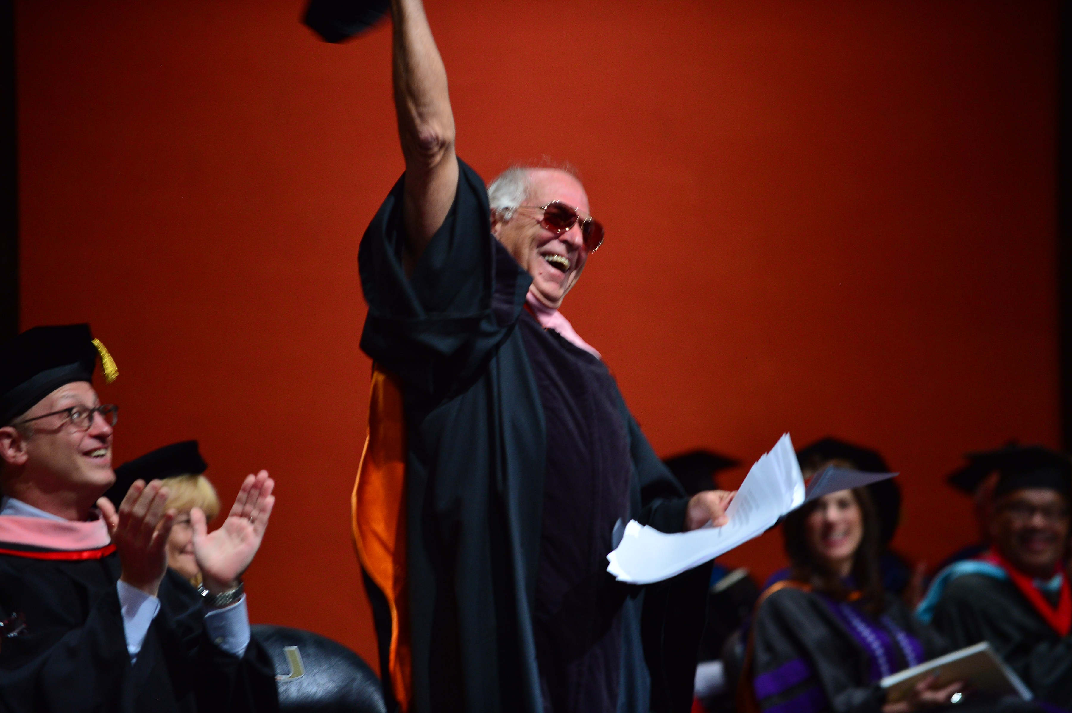 jimmy on stage during a graduation ceremony