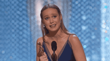 Brie Larson smiles accepting her Oscar.